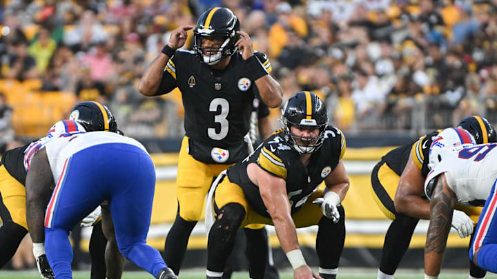 Pittsburgh Steelers quarterback Russell Wilson (3) calls out a coverage while waiting for center Zach Frazier (54) to snap the ball against the Buffalo Bills during the first quarter at Acrisure Stadium.