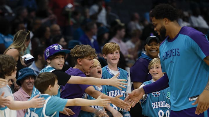 Apr 6, 2025; Charlotte, North Carolina, USA; Charlotte Hornets forward Miles Bridges greets Hornets fans before a game against the Chicago Bulls at Spectrum Center. Mandatory Credit: Nell Redmond-Imagn Images Apr 6, 2025; Charlotte, North Carolina, USA; Charlotte Hornets forward Miles Bridges greets Hornets fans before a game against the Chicago Bulls at Spectrum Center. Mandatory Credit: Nell Redmond-Imagn Images
