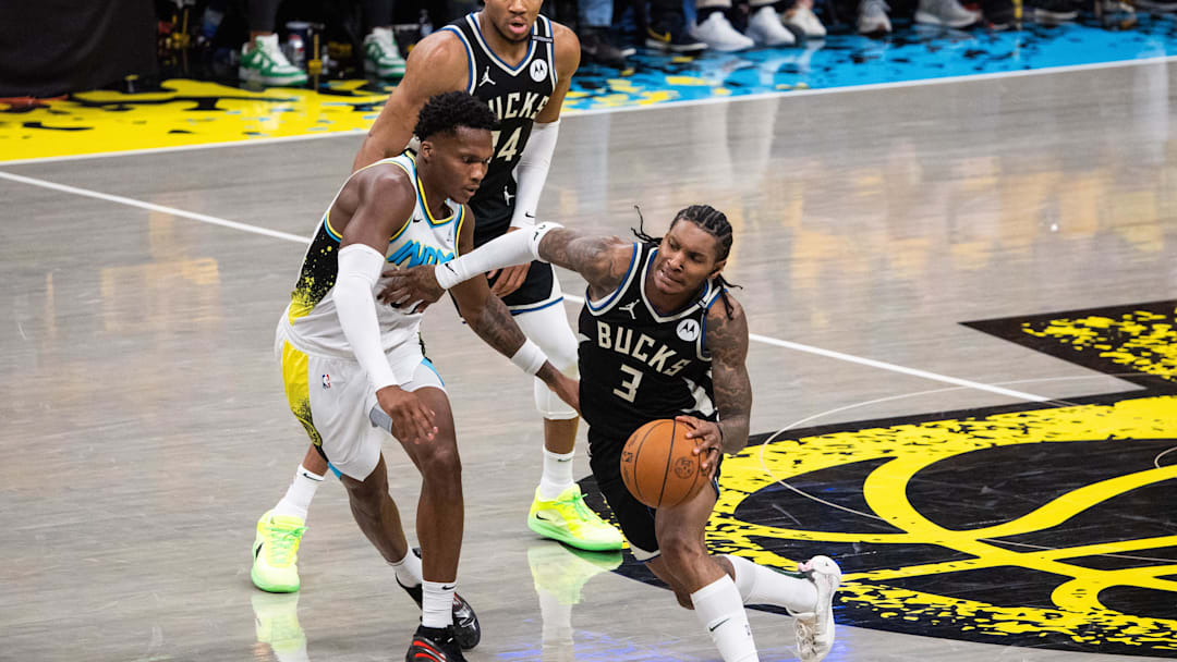 Apr 29, 2025; Indianapolis, Indiana, USA; Milwaukee Bucks guard Kevin Porter Jr. (3) dribbles the ball while Indiana Pacers guard Bennedict Mathurin (00) defends during game five of the first round for the 2024 NBA Playoffs at Gainbridge Fieldhouse. Mandatory Credit: Trevor Ruszkowski-Imagn Images