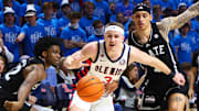 Feb 15, 2025; Oxford, Mississippi, USA; Mississippi Rebels guard Sean Pedulla (3) chases a loose ball as Mississippi State Bulldogs guard Josh Hubbard (12) and guard Riley Kugel (2) defend during the second half at The Sandy and John Black Pavilion at Ole Miss. Mandatory Credit: Petre Thomas-Imagn Images