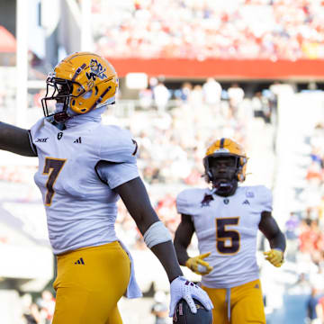 Nov 30, 2024; Tucson, Arizona, USA; Arizona State Sun Devils tight end Chamon Metayer (7) waves to the fans as he celebrates a touchdown against the Arizona Wildcats during the Territorial Cup at Arizona Stadium. Mandatory Credit: Mark J. Rebilas-Imagn Images