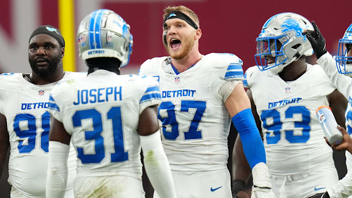 Detroit Lions defensive lineman Aidan Hutchinson (97) celebrates a stop by his team on fourth down against the Arizona Cardinals at State Farm Stadium in Glendale, Ariz., on Sep 22, 2024.