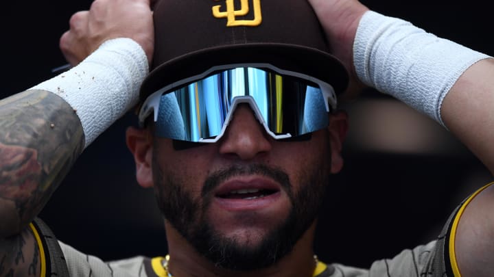 Aug 18, 2024; Denver, Colorado, USA; San Diego Padres outfielder David Peralta (24) gets ready to take the field for the ninth inning against the Colorado Rockies at Coors Field. Mandatory Credit: Christopher Hanewinckel-USA TODAY Sports