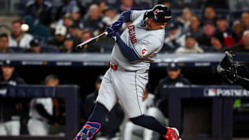 Oct 15, 2024; Bronx, New York, USA; Cleveland Guardians first base Josh Naylor (22) hits a single during the second inning against the New York Yankees in game two of the ALCS for the 2024 MLB Playoffs at Yankee Stadium. Mandatory Credit: Vincent Carchietta-Imagn Images