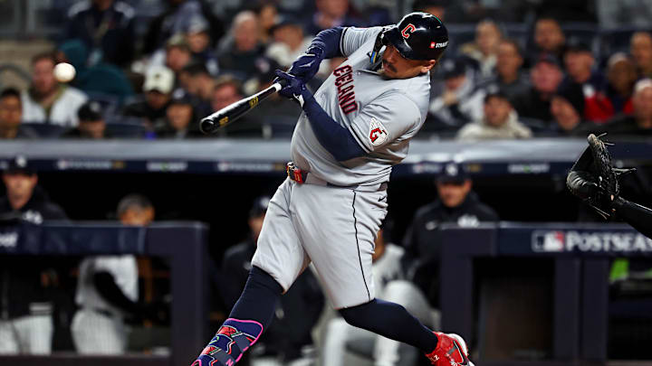 Oct 15, 2024; Bronx, New York, USA; Cleveland Guardians first base Josh Naylor (22) hits a single during the second inning against the New York Yankees in game two of the ALCS for the 2024 MLB Playoffs at Yankee Stadium. Mandatory Credit: Vincent Carchietta-Imagn Images