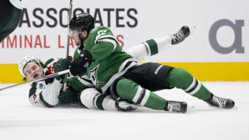 Sep 26, 2023; Dallas, Texas, USA; Minnesota Wild defenseman Kyle Masters (73) takes down Dallas