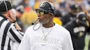 Nov 8, 2025; Morgantown, West Virginia, USA; Colorado Buffaloes head coach Deion Sanders walks along the sidelines late in the fourth quarter against the West Virginia Mountaineers at Milan Puskar Stadium. Mandatory Credit: Ben Queen-Imagn Images
