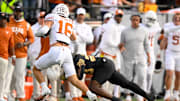 Oct 26, 2024; Nashville, Tennessee, USA;  Vanderbilt Commodores running back Sedrick Alexander (28) tackles Texas Longhorns defensive back Michael Taaffe (16) after the interception during the first half at FirstBank Stadium. Mandatory Credit: Steve Roberts-Imagn Images