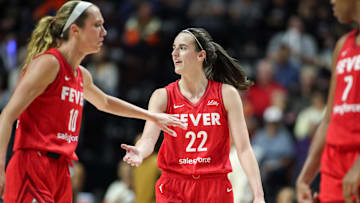 Sep 25, 2024; Uncasville, Connecticut, USA; Indiana Fever guard Caitlin Clark (22) reacts during the second half against the Connecticut Sun during game two of the first round of the 2024 WNBA Playoffs at Mohegan Sun Arena. Mandatory Credit: Paul Rutherford-Imagn Images