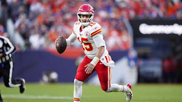 Nov 16, 2025; Denver, Colorado, USA; Kansas City Chiefs quarterback Patrick Mahomes (15) scrambles with the ball in the third quarter against the Denver Broncos at Empower Field at Mile High. Mandatory Credit: Ron Chenoy-Imagn Images