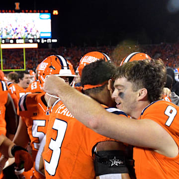 Sep 7, 2024; Champaign, Illinois, USA; Illinois Fighting Illini quarterback Luke Altmyer (9) and teammates celebrate a win over the Kansas Jayhawks at Memorial Stadium. Mandatory Credit: Ron Johnson-Imagn Images