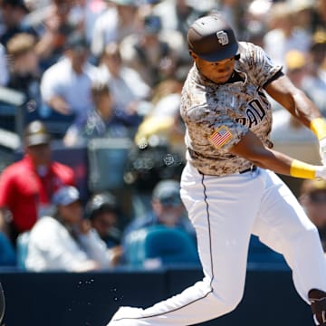 Apr 13, 2025; San Diego, California, USA; San Diego Padres first baseman Oscar Gonzalez (39) hits an rbi single during the first inning against the Colorado Rockies at Petco Park. Mandatory Credit: David Frerker-Imagn Images