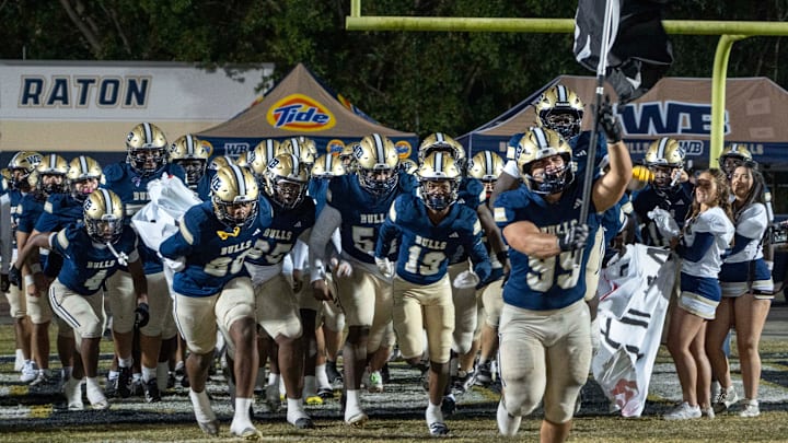 West Boca players storm on to the field against Miami Southridge in the state semifinal game on December 6, 2024, in Boca Raton, Florida.