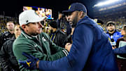 Michigan State head coach Jonathan Smith, left, shakes hands with head coach Sherrone Moore after 24-17 loss at Michigan Stadium in Ann Arbor on Saturday, Oct. 26, 2024.