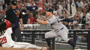 Aug 26, 2024; Washington, District of Columbia, USA; New York Yankees first baseman DJ LeMahieu (26) catches the ball in front of Washington Nationals left fielder James Wood (29) for a force out at first base during the fourth inning at Nationals Park.