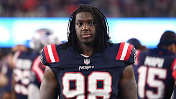 August 8, 2024; Foxborough, MA, USA;  New England Patriots defensive tackle Jeremiah Pharms Jr. (98) watches from the sideline during the second half against the Carolina Panthers at Gillette Stadium. Mandatory Credit: Eric Canha-Imagn Images