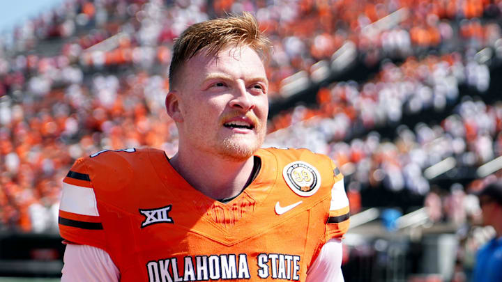 Oklahoma State's Alan Bowman (7) celebrates following the college football game between the Oklahoma State Cowboys and the Arkansas Razorbacks at Boone Pickens Stadium in Stillwater, Okla.,, Saturday, Sept., 7, 2024.