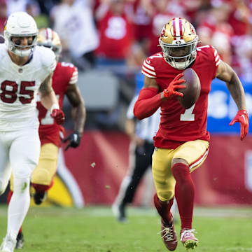 Dec 17, 2023; Glendale, Arizona, USA; San Francisco 49ers cornerback Charvarius Ward (7) runs back an interceptions for a touchdown during the first quarter against the Arizona Cardinals at State Farm Stadium. 