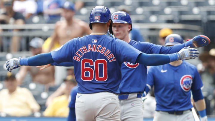 Aug 28, 2024; Pittsburgh, Pennsylvania, USA;  Chicago Cubs center tfielder Pete Crow-Armstrong (rear) greets catcher Christian Bethancourt (60) crossing home plate on a two run home run against the Pittsburgh Pirates during the seventh inning at PNC Park.