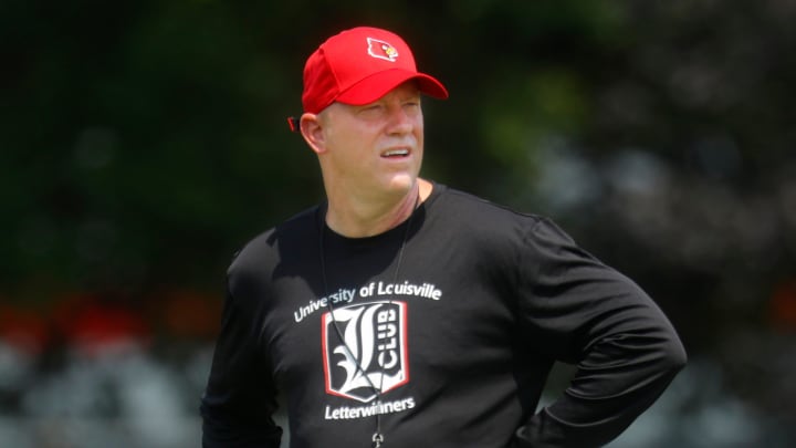 Louisville's Jeff Brohm coaches during one of their practices