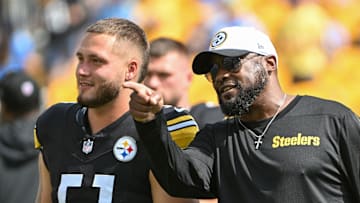 Sep 22, 2024; Pittsburgh, Pennsylvania, USA; Pittsburgh Steelers head coach Mike Tomlin talks with linebacker Nick Herbig (51) before a game against the Los Angeles Chargers at Acrisure Stadium. Mandatory Credit: Barry Reeger-Imagn Images