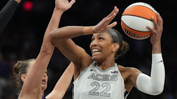 Aug 15, 2025; Phoenix, Arizona, USA; Las Vegas Aces center A'ja Wilson (22) shoots over Phoenix Mercury guard Sami Whitcomb (33) in the first half at Footprint Center. Mandatory Credit: Rick Scuteri-Imagn Images