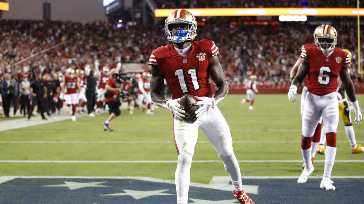 Sep 26, 2021; Santa Clara, California, USA; San Francisco 49ers wide receiver Brandon Aiyuk (11) reacts after catching a touchdown during the third quarter against the Green Bay Packers at Levi's Stadium. Mandatory Credit: Darren Yamashita-USA TODAY Sports