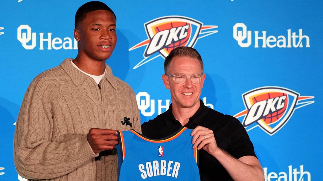 Thunder draft pick Thomas Sorber poses for a photo with general manager Sam Presti during a press conference at the First American's Museum in Oklahoma City, Saturday, June 28, 2025.