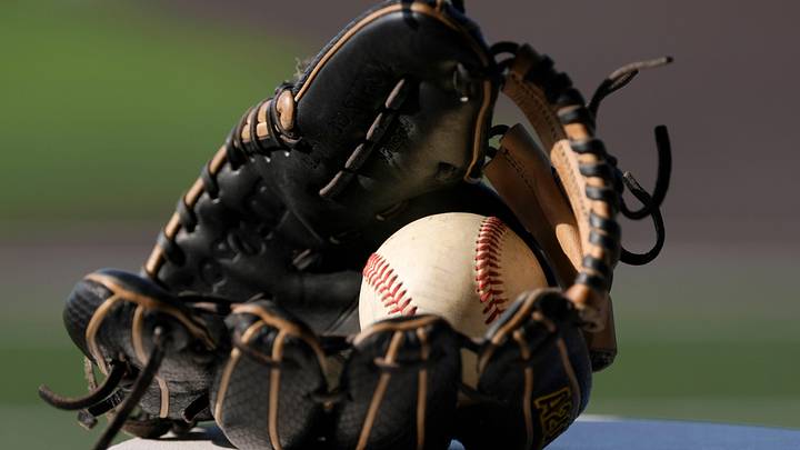 A baseball is pictured inside a glove during the Class 2A high school baseball championship between Latta and Colbert in Shawnee, Okla., Saturday, May 16, 2026. Latta won 6-5.
