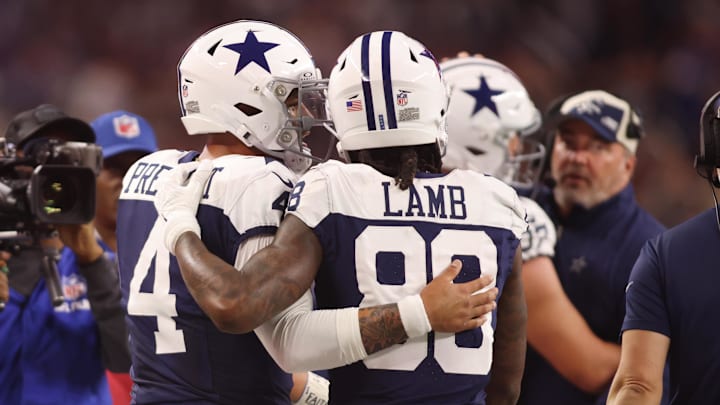 Dallas Cowboys wide receiver CeeDee Lamb and Dak Prescott talk during the game against the Washington Commanders.
