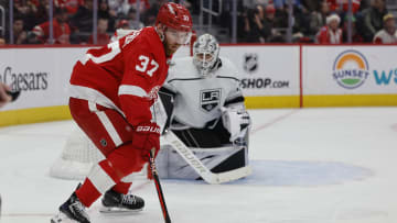 Jan 13, 2024; Detroit, Michigan, USA;  Detroit Red Wings left wing J.T. Compher (37) skates with the puck in front of Los Angeles Kings goaltender Cam Talbot (39) in the second period at Little Caesars Arena. Mandatory Credit: Rick Osentoski-USA TODAY Sports