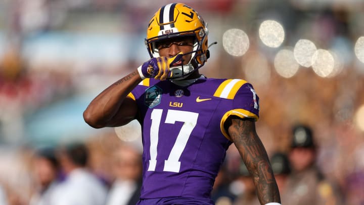 Jan 1, 2024; Tampa, FL, USA;  LSU Tigers wide receiver Chris Hilton Jr. (17) reacts after catching a pass against the Wisconsin Badgers in the fourth quarter during the ReliaQuest Bowl at Raymond James Stadium. Mandatory Credit: Nathan Ray Seebeck-USA TODAY Sports