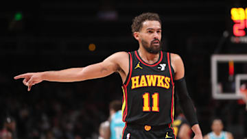 Mar 12, 2025; Atlanta, Georgia, USA; Atlanta Hawks guard Trae Young (11) points to the referee against the Charlotte Hornets during the second half at State Farm Arena. Mandatory Credit: Mady Mertens-Imagn Images