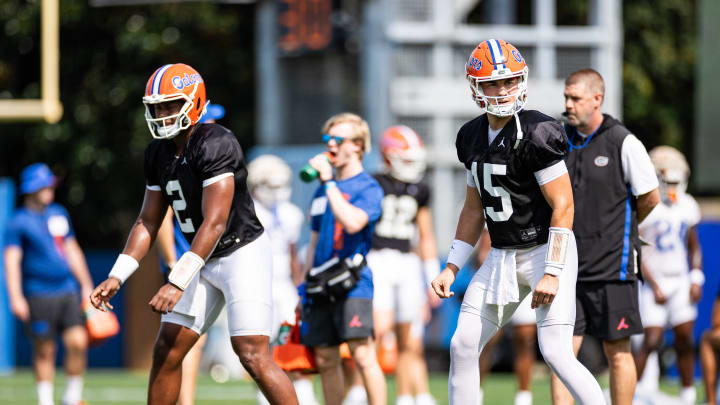 Florida Gators quarterback DJ Lagway (2) and Florida Gators quarterback Graham Mertz (15) line up during fall football practice.