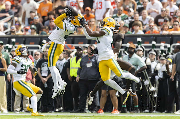 Green Bay Packers safety Xavier McKinney (29) intercepts a pass by the Cleveland Browns just before halftime.