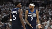 May 26, 2025; Minneapolis, Minnesota, USA; Minnesota Timberwolves guard Nickeil Alexander-Walker (9) and guard Anthony Edwards (5) talk against the Oklahoma City Thunder in the second half during game four of the western conference finals for the 2025 NBA Playoffs at Target Center. Mandatory Credit: Bruce Kluckhohn-Imagn Images