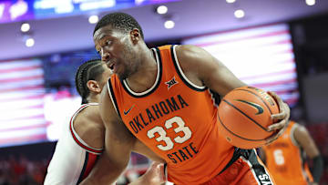 Feb 4, 2025; Houston, Texas, USA; Oklahoma State Cowboys forward Abou Ousmane (33) controls the ball during the second half against the Houston Cougars at Fertitta Center. Mandatory Credit: Troy Taormina-Imagn Images