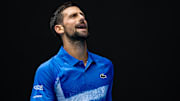 Jan 15, 2025; Melbourne, Victoria, Australia; Novak Djokovic of Serbia gestures during his match against Jaime Faria of Portugal in the second round of the men's singles at the 2025 Australian Open at Melbourne Park. Mandatory Credit: Mike Frey-Imagn Images