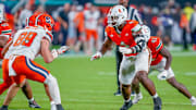 Nov 8, 2025; Miami Gardens, Florida, USA; Miami Hurricanes defensive lineman Rueben Bain Jr. (4) prepares to rush against the Syracuse Orange during the third quarter at Hard Rock Stadium. Mandatory Credit: Jeff Romance-Imagn Images