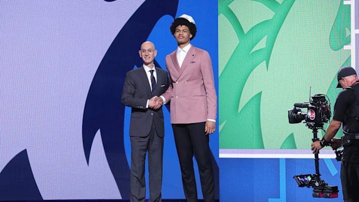 Jun 25, 2025; Brooklyn, NY, USA;  Joan Beringer stands with NBA commissioner Adam Silver after being selected as the 17th pick by the Minnesota Timberwolves in the first round of the 2025 NBA Draft at Barclays Center. Mandatory Credit: Brad Penner-Imagn Images