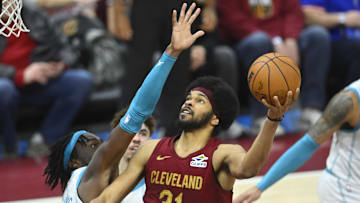 Jan 5, 2025; Cleveland, Ohio, USA; Cleveland Cavaliers center Jarrett Allen (31) shoots beside Charlotte Hornets center Mark Williams (5) in the fourth quarter at Rocket Mortgage FieldHouse. Mandatory Credit: David Richard-Imagn Images