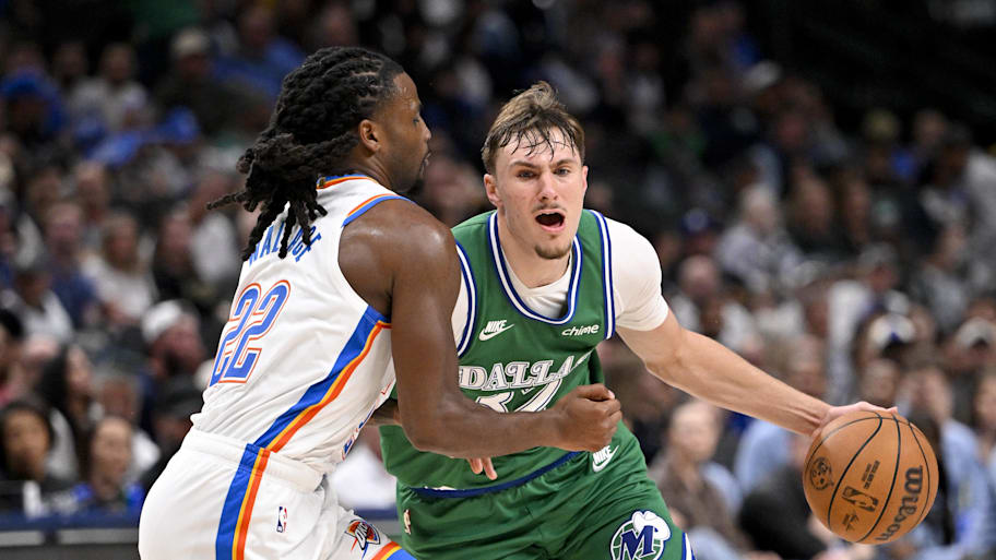 Mavericks forward Cooper Flagg is fouled by Thunder guard Cason Wallace.