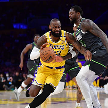 Apr 30, 2025; Los Angeles, California, USA; Los Angeles Lakers forward LeBron James (23) moves to the basket against Minnesota Timberwolves forward Julius Randle (30) during the first half in game five of first round for the 2025 NBA Playoffs at Crypto.com Arena. Mandatory Credit: Gary A. Vasquez-Imagn Images