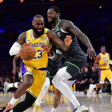 Apr 30, 2025; Los Angeles, California, USA; Los Angeles Lakers forward LeBron James (23) moves to the basket against Minnesota Timberwolves forward Julius Randle (30) during the first half in game five of first round for the 2025 NBA Playoffs at Crypto.com Arena. Mandatory Credit: Gary A. Vasquez-Imagn Images