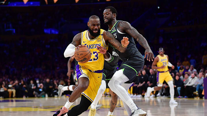 Apr 30, 2025; Los Angeles, California, USA; Los Angeles Lakers forward LeBron James (23) moves to the basket against Minnesota Timberwolves forward Julius Randle (30) during the first half in game five of first round for the 2025 NBA Playoffs at Crypto.com Arena. Mandatory Credit: Gary A. Vasquez-Imagn Images