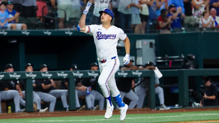 Jul 24, 2024; Arlington, Texas, USA; Texas Rangers first baseman Nathaniel Lowe (30) reacts after hitting a three run during the eighth inning against the Chicago White Sox at Globe Life Field. Mandatory Credit: Kevin Jairaj-USA TODAY Sports