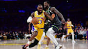 Los Angeles Lakers forward LeBron James moves to the basket against Minnesota Timberwolves forward Julius Randl  during the first half in game five.