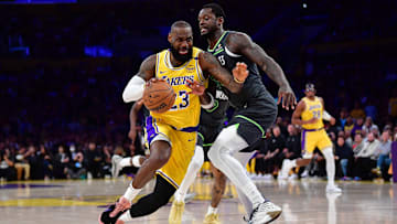 Los Angeles Lakers forward LeBron James moves to the basket against Minnesota Timberwolves forward Julius Randl  during the first half in game five.