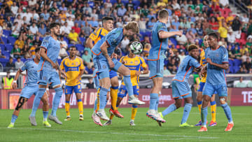 Aug 13, 2024; Harrison, New Jersey, USA; New York City FC midfielder Keaton Parks (55) clears the ball in front of Tigres UANL forward Nicolas Ibanez (9) during the second half at Red Bull Arena. Mandatory Credit: Vincent Carchietta-USA TODAY Sports