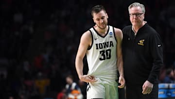  Iowa head coach Fran McCaffery embraces Iowa forward Connor McCaffery (30)